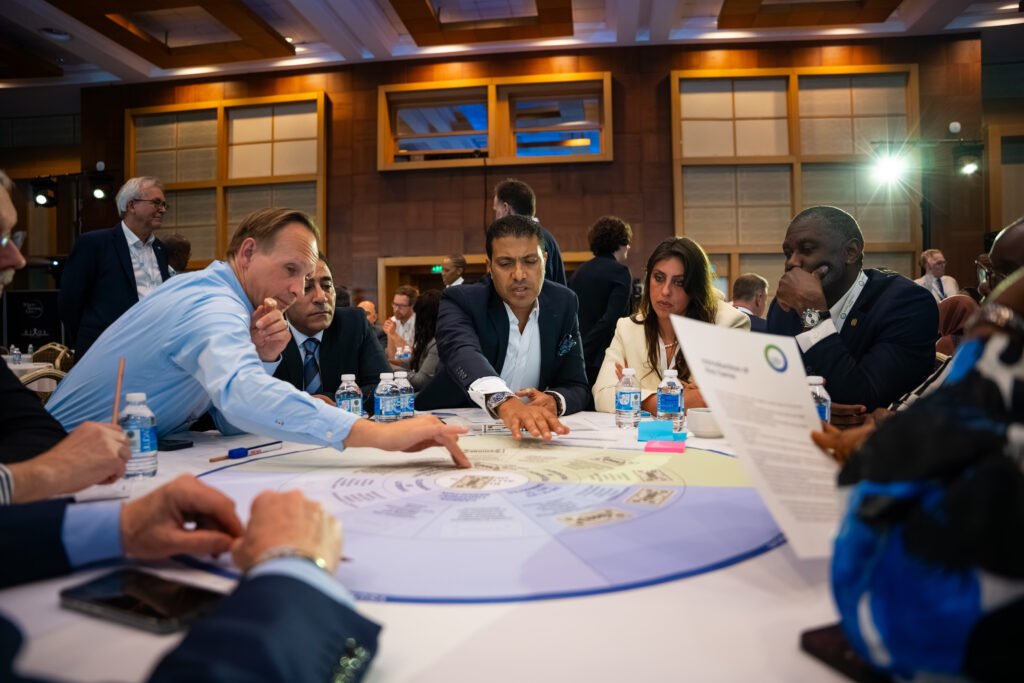 Member representatives networking and sharing ideas during an International Currency Association event focused on innovation, resilience, and the future of cash.